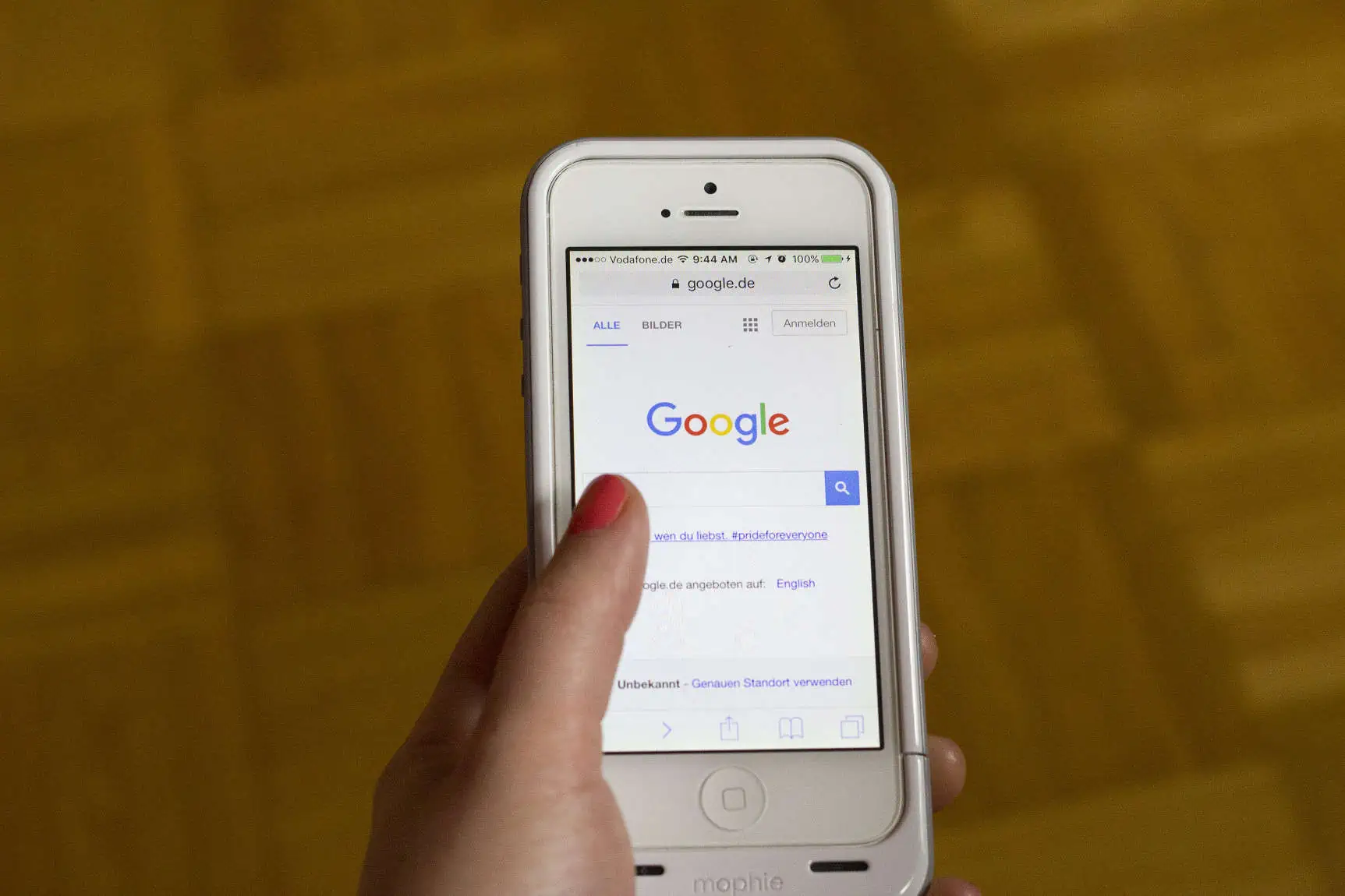 A smartphone displaying the Google homepage