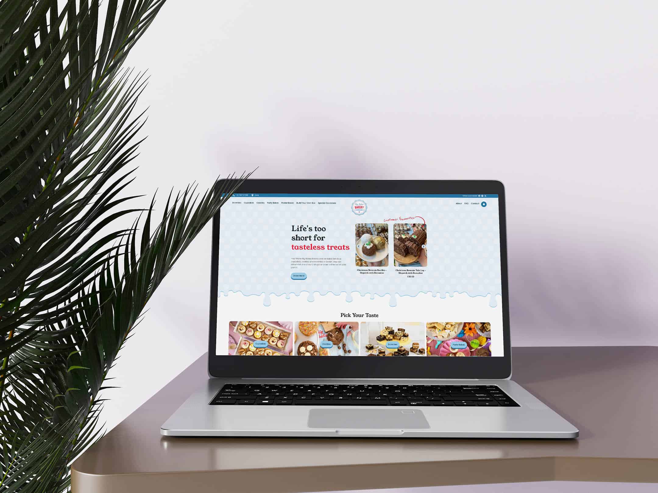 A laptop displaying the Big Bakes Bakery homepage