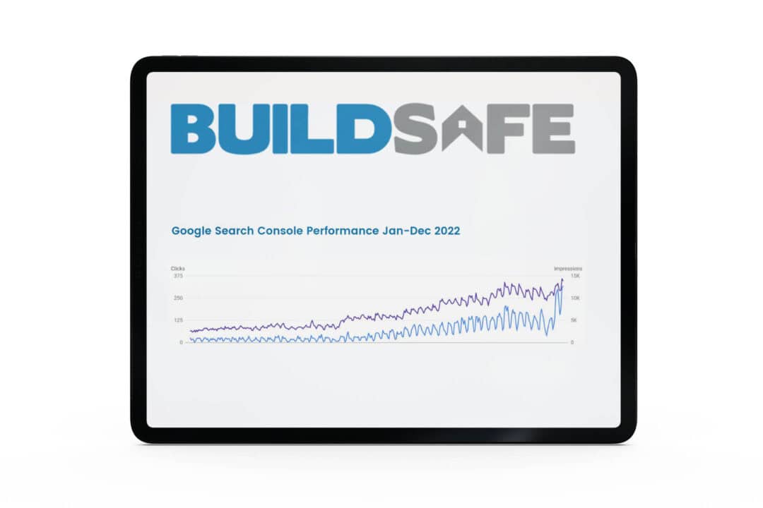 A tablet showing an upwardly trending Google Search Console performance clicks and impressions chart for Buildsafe