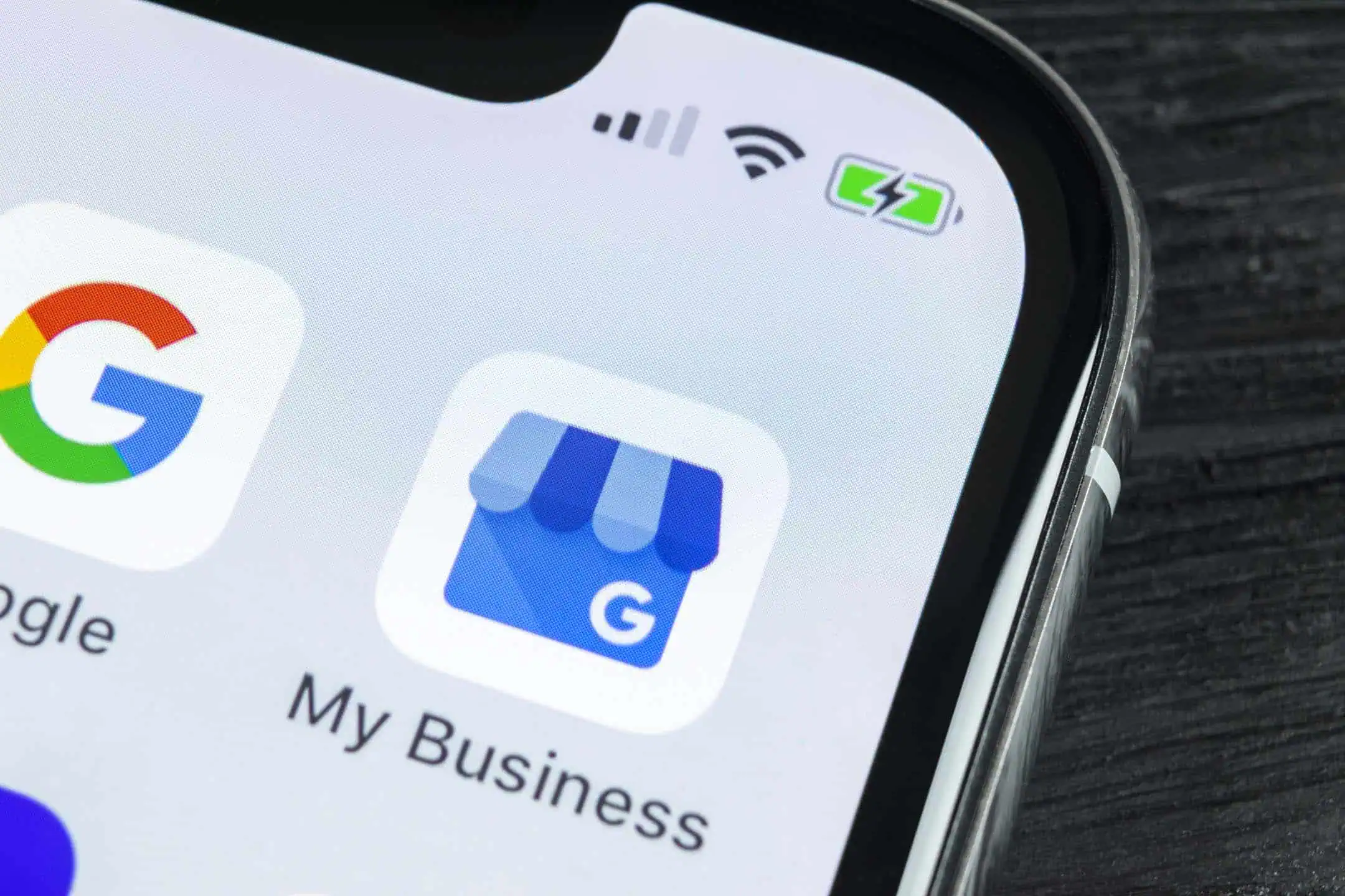 A close-up of a smartphone displaying the Google My Business app icon