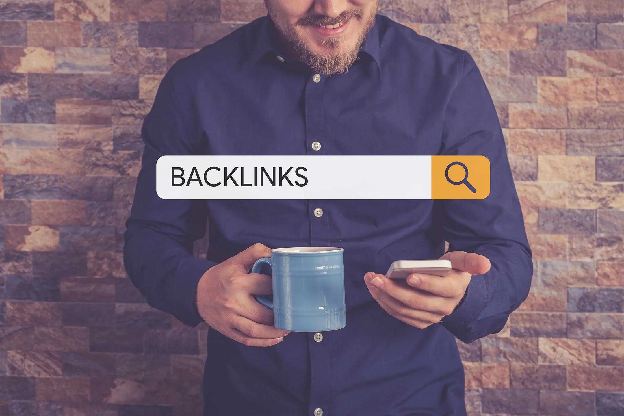 A man looking at his smartphone while holding a cup of coffee, with a graphical overlay of the word Backlinks in a search bar