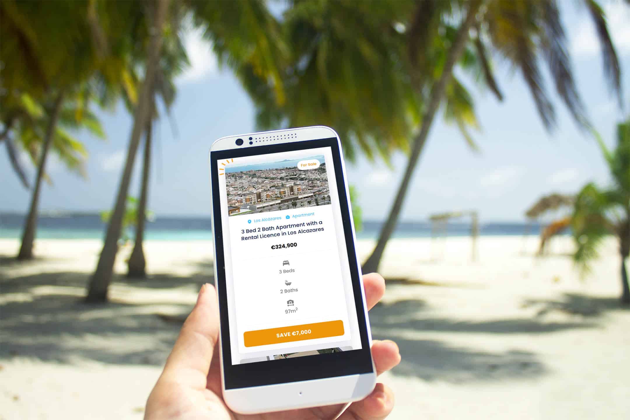 A smartphone user on a beach sarching for properties on the Movehappy website