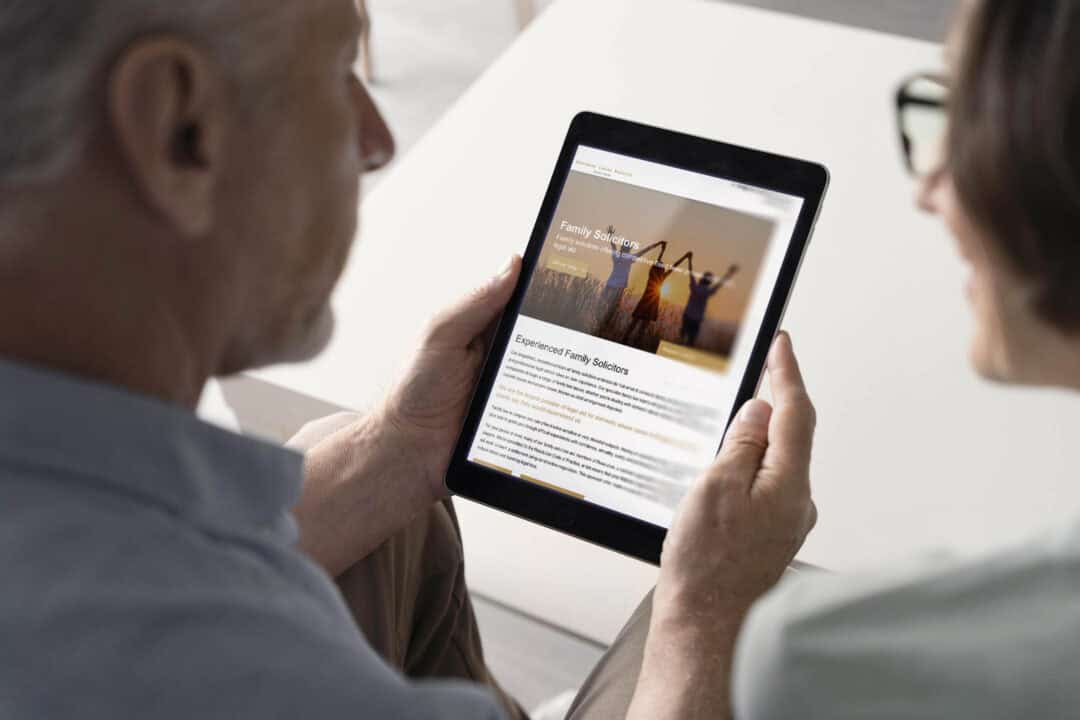 A couple browsing the NCDV website on a tablet