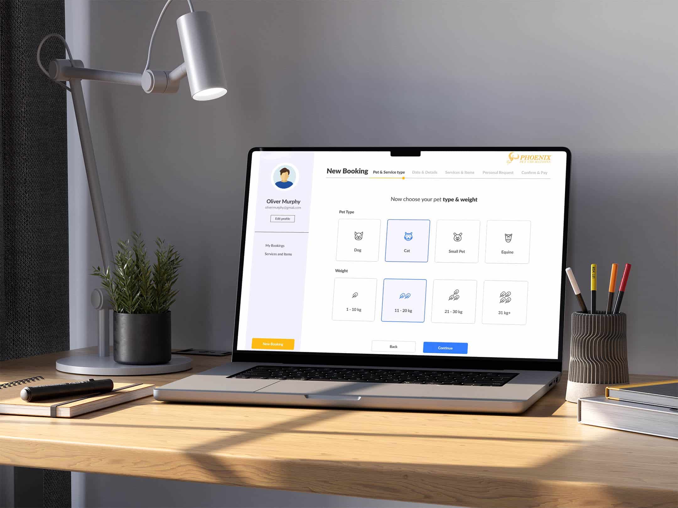A laptop displaying the Phoenix Pet Cremations new booking page