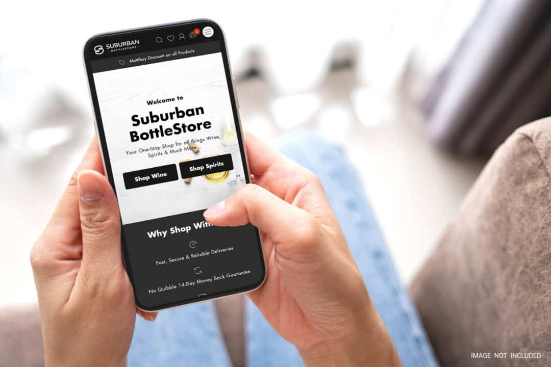 A smartphone user browsing the Suburban Bottlestore homepage